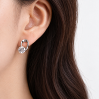 Rotating Volute Earrings — A Curve Around the Light